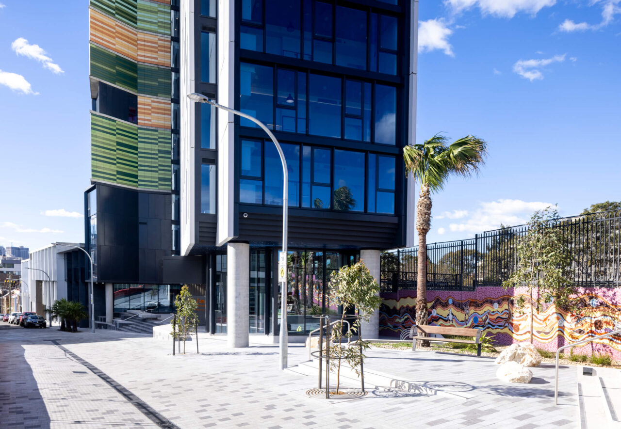 Main entry of Coljames student housing showcasing Australia's terracotta facade with tonal variations, designed by Architect Turner for a unique and striking visual effect