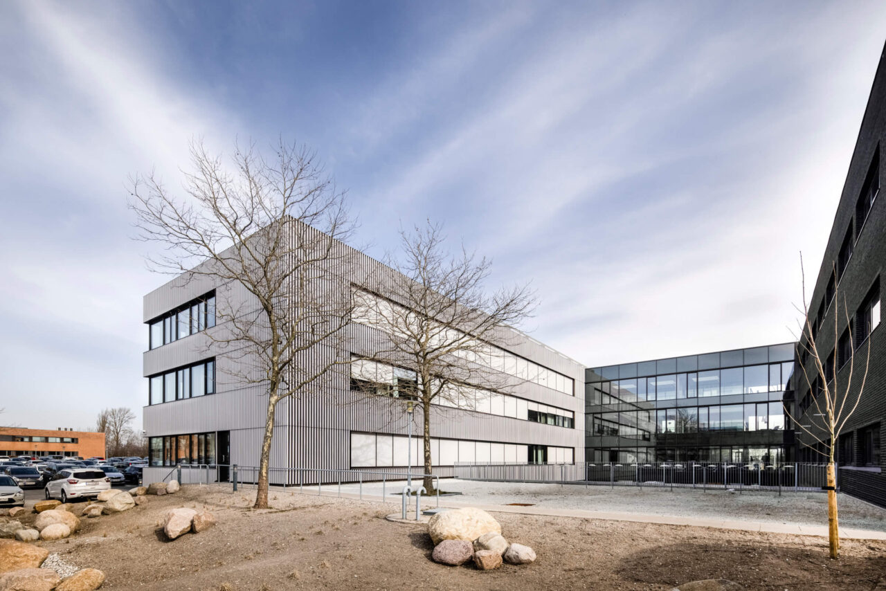 Terracotta facade of Velliv Ballerup office building in Denmark seen from backyard - a tonality reference